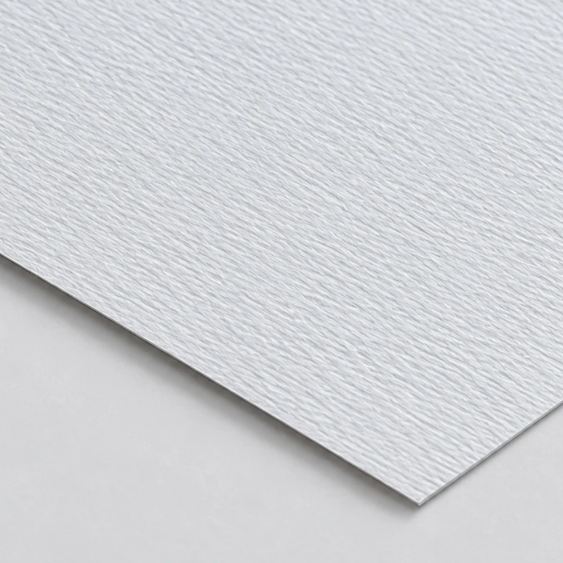 Textured Paper White textured paper sheet showing a fine rippled surface.