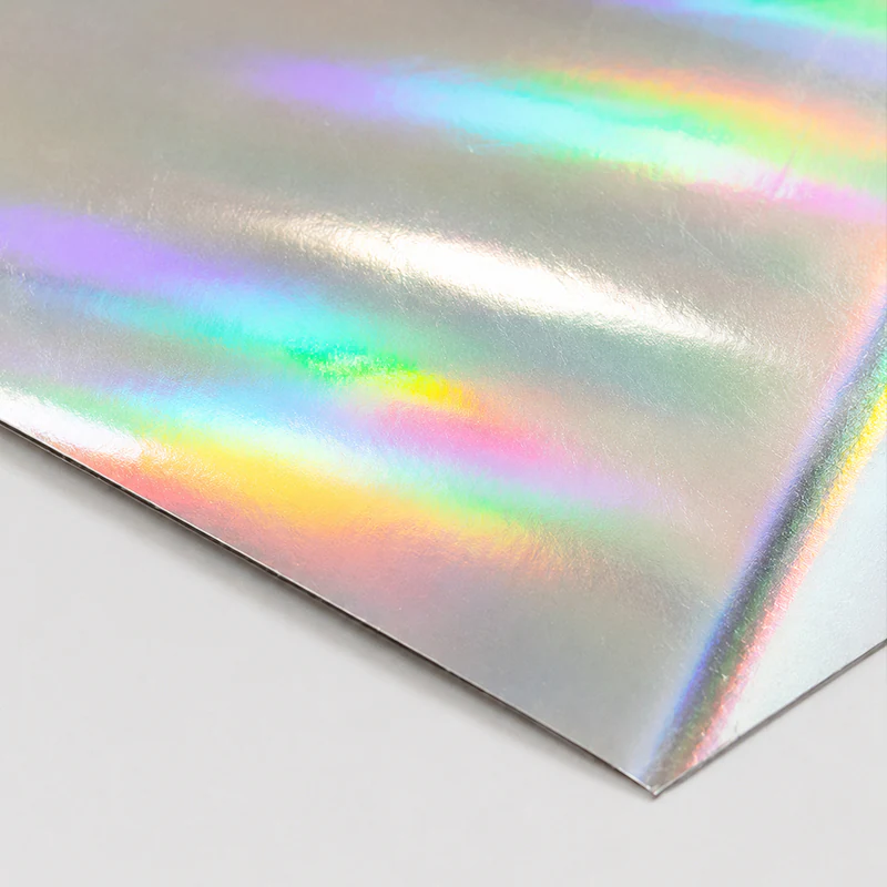 Holographic Paper Holographic paper sheet reflecting bands of rainbow colour.