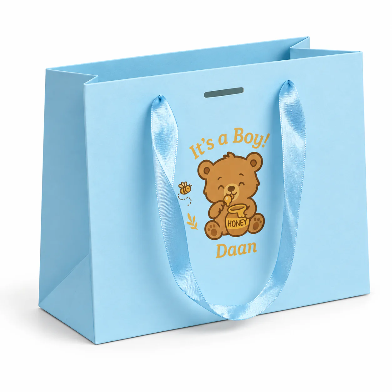 Three-quarter view of a light blue paper gift bag with matching satin ribbon handles and illustrated printing.