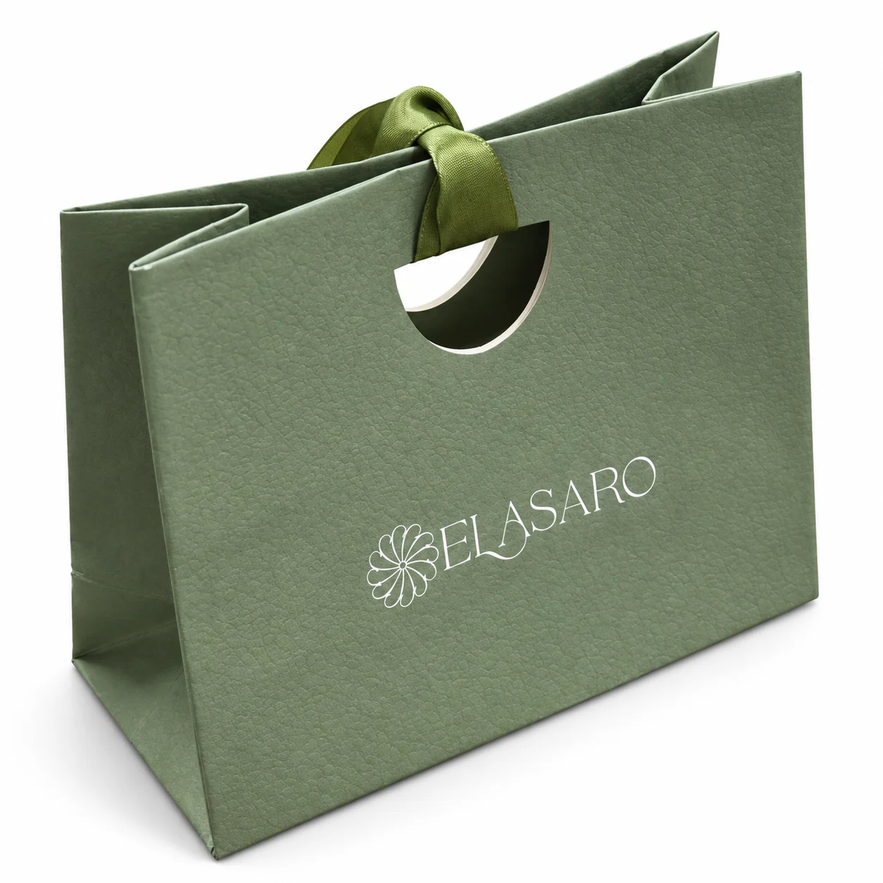 Textured green paper bag with a half-round die-cut handle, green ribbon tie and white logo.