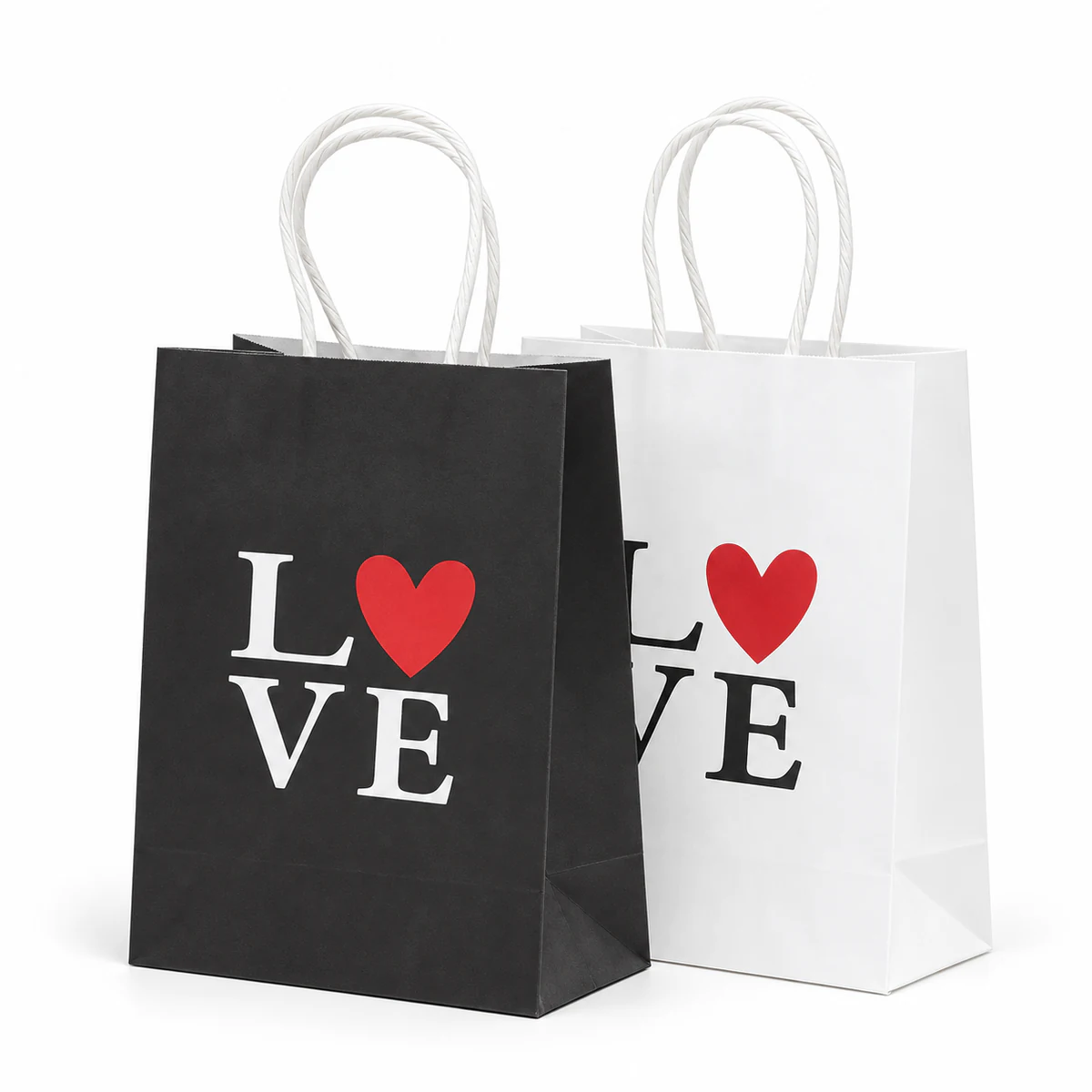 Black and white Valentine paper bags Black and white paper bags with white paper handles, bold LOVE lettering and red hearts.