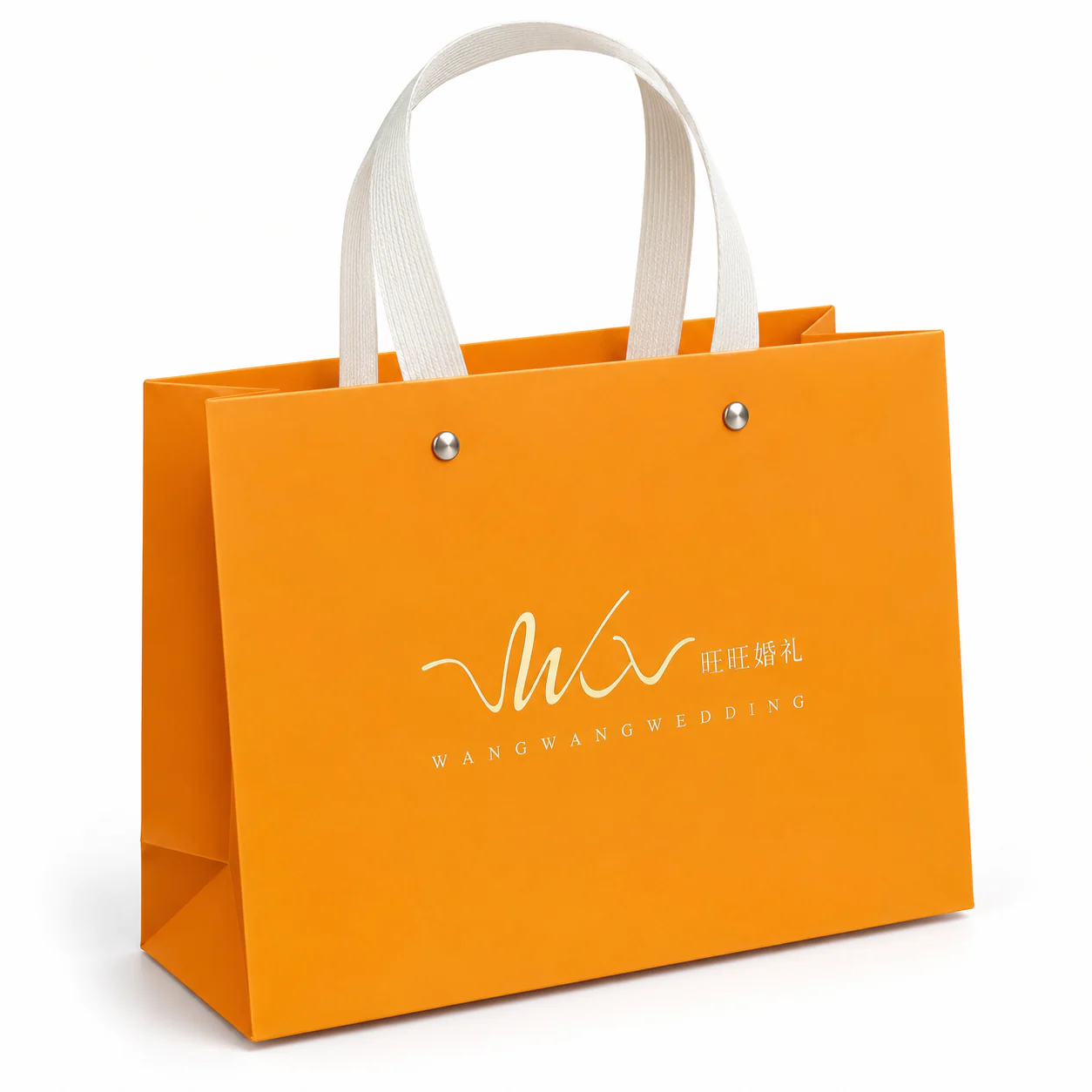 Orange paper bag with white handles, silver rivets and gold wedding artwork.