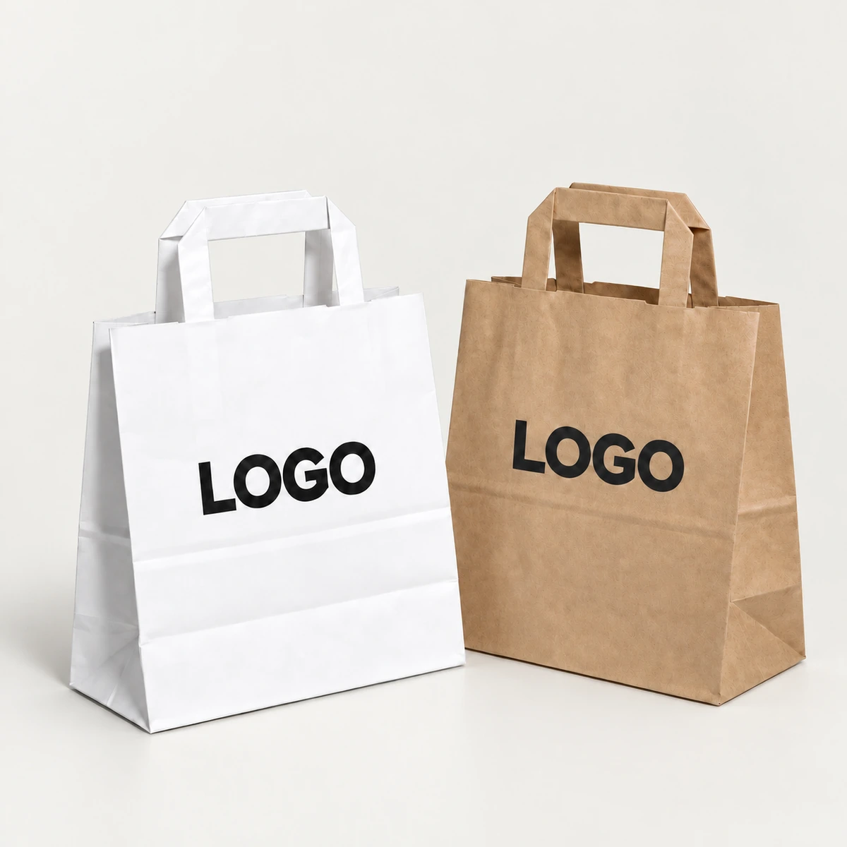 White and brown paper bags with flat paper handles and black printed logos