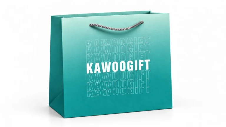 Teal paper shopping bag with repeated KAWOOGIFT lettering and a silver rope handle on a white background.