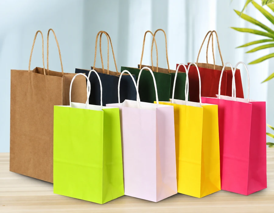 Eight shopping bags in brown, dark and bright colours arranged in two rows with brown and white twisted handles.