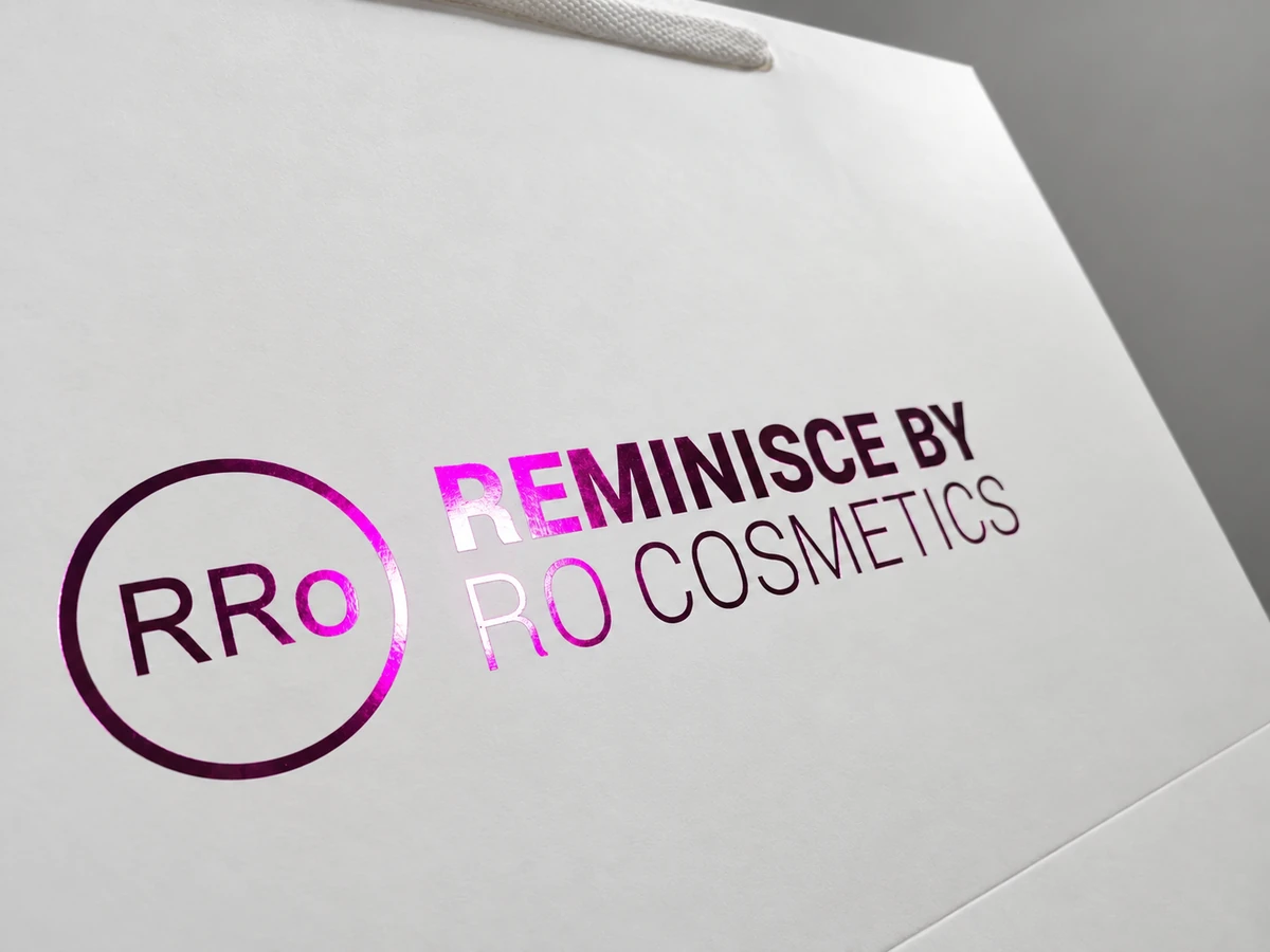 Colour-shifting RRO cosmetics foil logo and lettering on a white paper bag